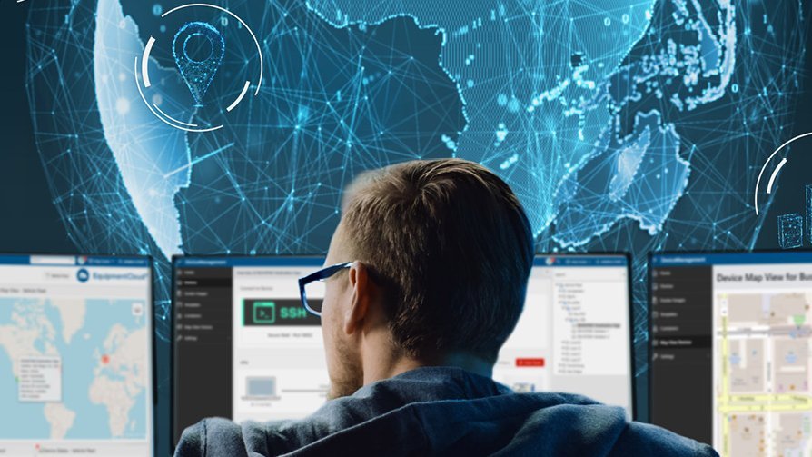 Woman with headset looking at two monitors