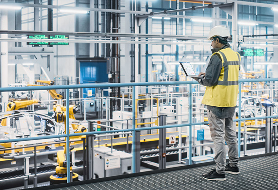 Man with tablet on factory floor