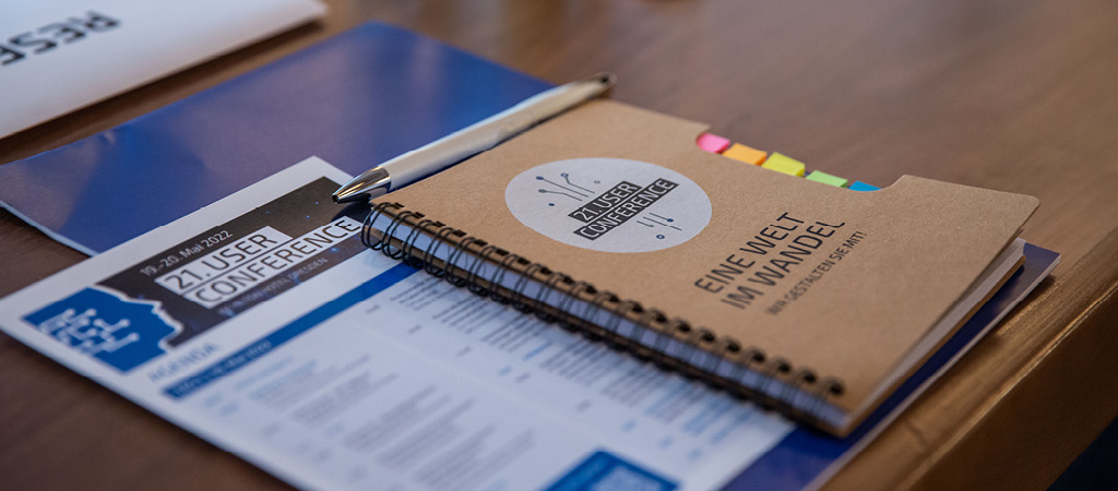 Agenda and writing materials on a table